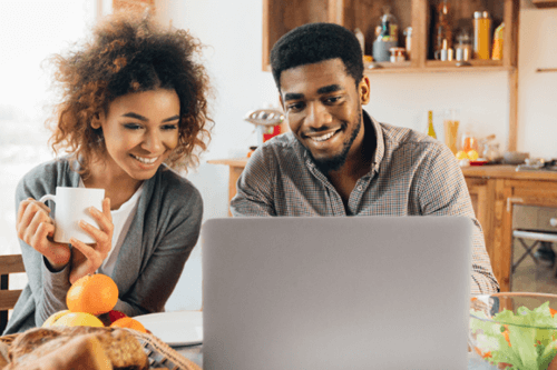 African American Couple looking at computer together