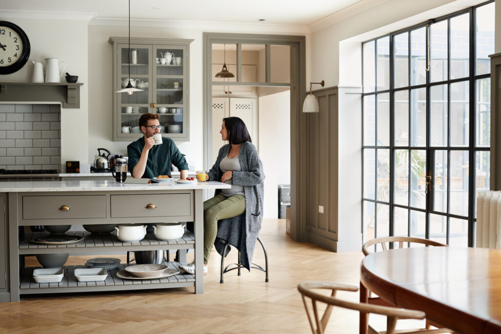 Shot of a young couple having breakfast together at home