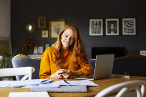 Young woman at home desk