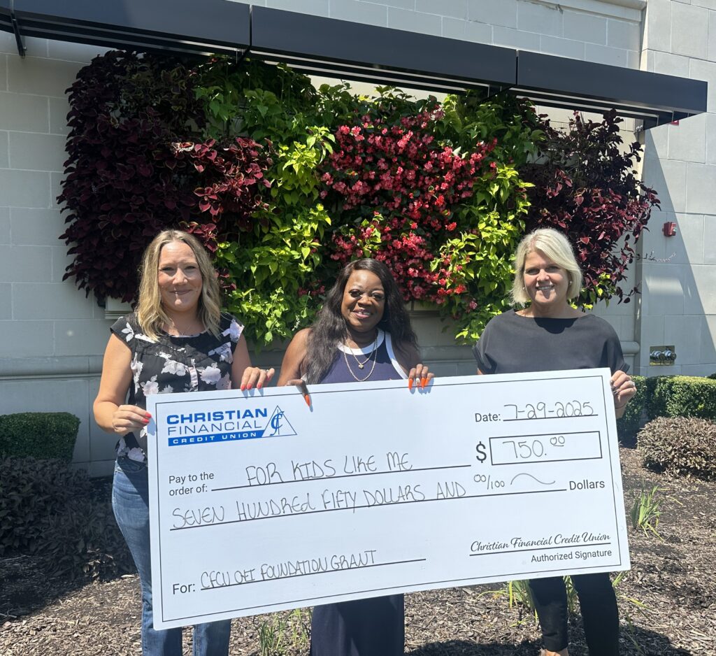 Check presentation in front of garden wall