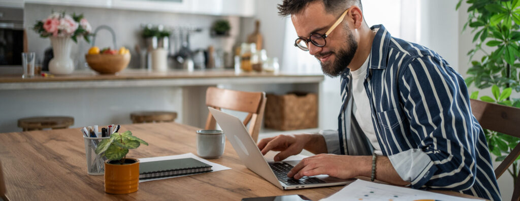 you man on a laptop at home