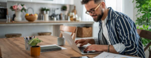 you man on a laptop at home